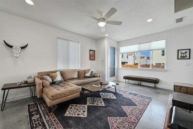 Living room with finished concrete flooring, base