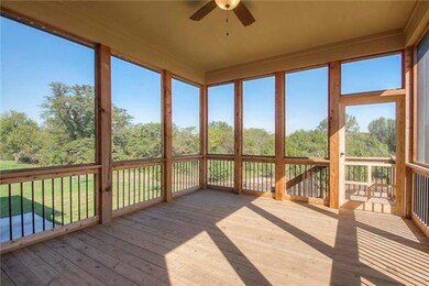 Over sized screen-in deck, with ceiling fan.
