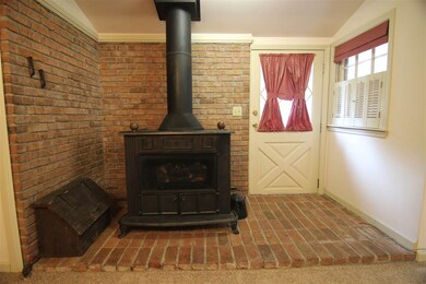 Gas log/Cast Iron Stove in the den.