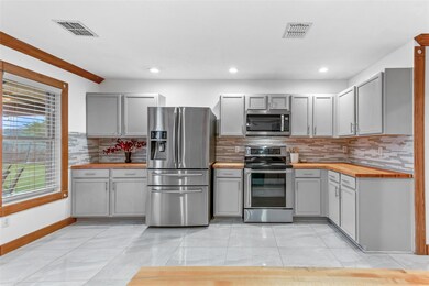 Kitchen featuring appliances with stainless steel 