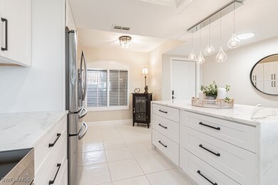 Island with granite waterfall countertops and draw