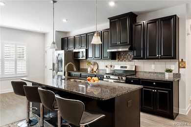 Large kitchen is a chef's dream! EVP flooring, rec