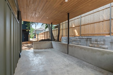 View of patio with fence