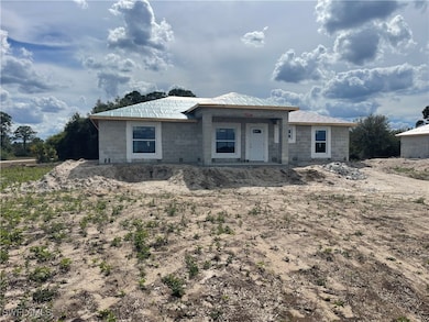 View of front of house featuring concrete block si