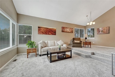 Formal dining room looks over living room. New carpet