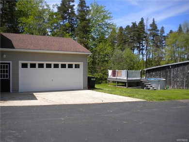 2.5 attached heated garage. Above ground pool with