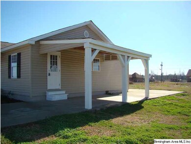 Carport with door to kitchen.