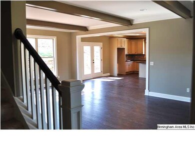 Beautiful exposed beams and hardwood flooring add 