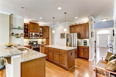 Kitchen with Granite Island for Storage and Counte