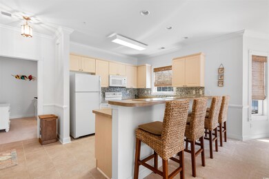 Kitchen featuring light carpet, white appliances, 