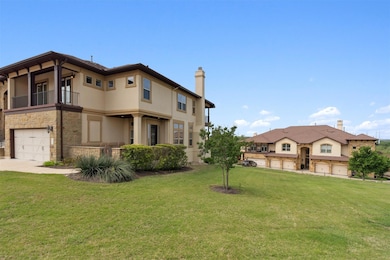 The two-car garage is tucked beside a welcoming front courtyard, giving the home a distinct presence and sense of space from the moment you arrive