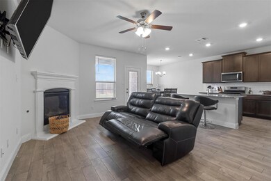 Living room with light hardwood / wood-style floor