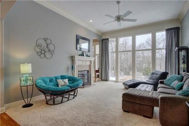 Wall of windows in great room overlooking scenic b