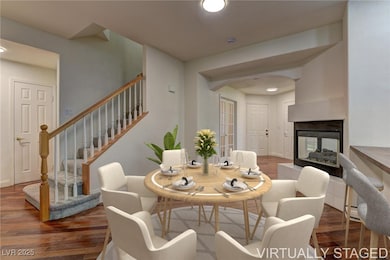 Virtually Staged; Dining space featuring wood fini