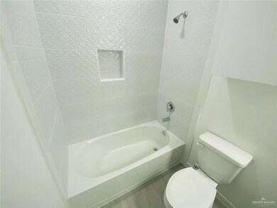 Full bath with toilet, shower / tub combination, and tile patterned flooring