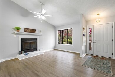 Entrance foyer featuring NEW LVP flooring, vaulted