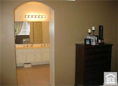 ARCHED ENTRY TO MASTER BATH