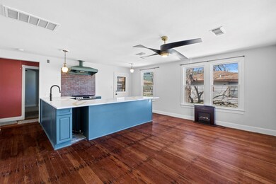 Kitchen featuring dark wood finished floors, ligh