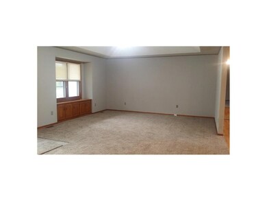 View of living room from hall that goes to bedroom