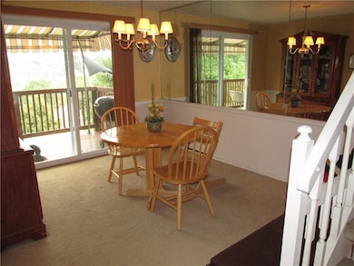 Brand new sliding glass doors lead to the deck.