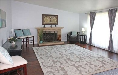 Formal Living Room with Travertine Fireplace, Wood