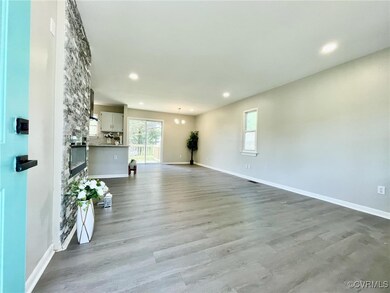 Unfurnished living room with baseboards, recessed