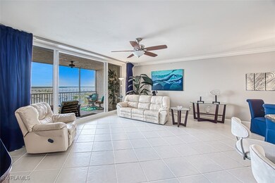 Living room with ceiling fan, light tile patterned