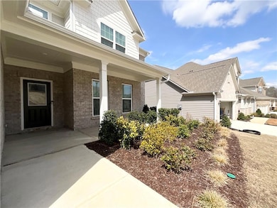 Doorway to property featuring covered porch and br