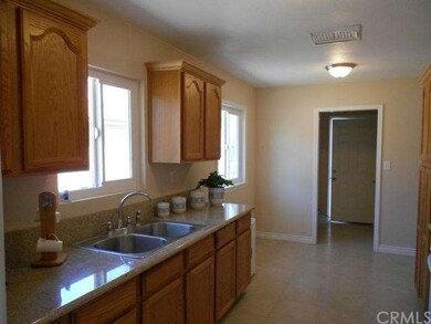 Remodeled kitchen with granite counters, refinishe