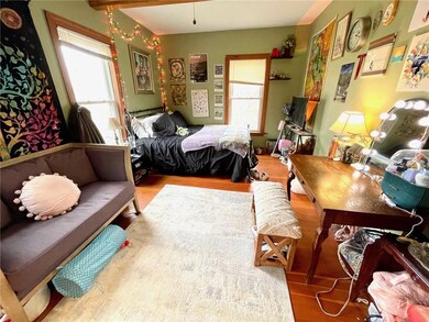2nd level bedroom with wood floors.