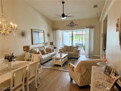 Living area featuring ceiling fan, wood finished f