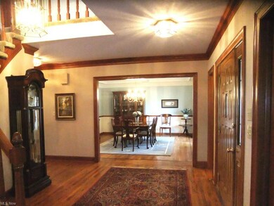 Bright and spacious foyer with beautiful woodwork.