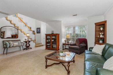 View of the foyer and staircase from the formal li