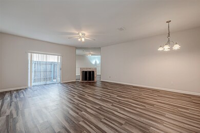 Ceramic tile flooring runs throughout the living a