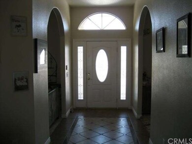 Interior entrance view with custom tile floor.