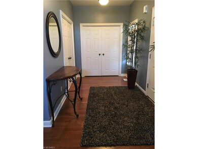 hardwood foyer with large coat closet