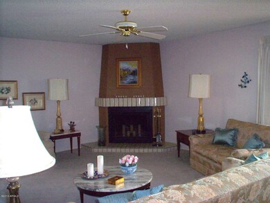 LIVING ROOM WITH CORNER FIREPLACE
