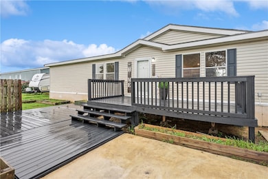View of wooden front entry way deck