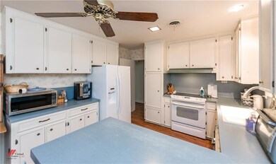 Great kitchen with an abundance of cabinet and cou