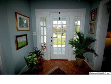 A bright and open foyer says 