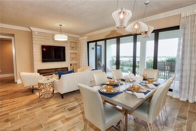 Dining room featuring a textured ceiling, a firepl