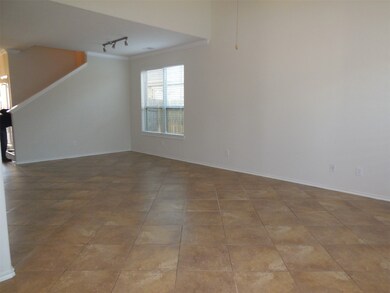 View dining/living room view. Extensive tile flooring downstairs.