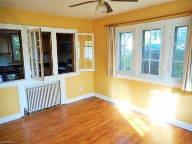 Lounge area with bay windows looking into the kitc