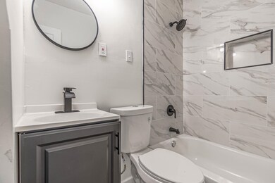 Full bathroom featuring washtub / shower combinati