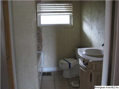 The hall bath has been updated and has a jetted tu