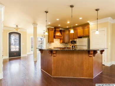 granite... stainless steel appliances... pendant lights and recess lights.