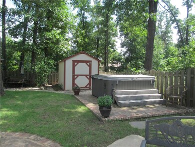 Hot tub on custom slab and storage unit