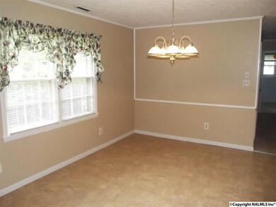 Spacious Dining Room has Vinyl Flooring with Tile Design.