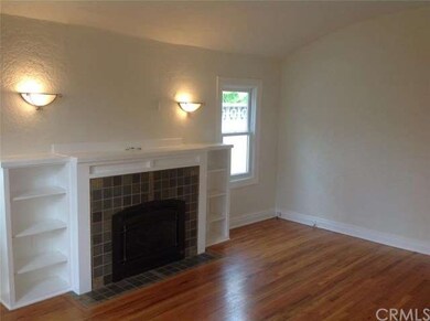 Living room with fireplace and barrel ceiling.