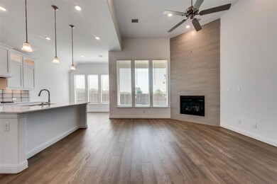Kitchen with hardwood / wood-style flooring, ceili